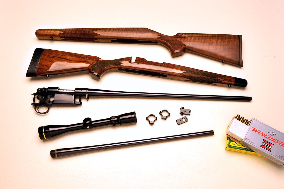 All the components are laid out for Stan’s new rifle. On the very top is the old Remington Classic stock. Below that is the new wood from Stocky’s, followed by the barreled action from Shaw Custom Barrels, the Leupold scope, bases and rings. On the very bottom is the old 7mm/08 barrel.